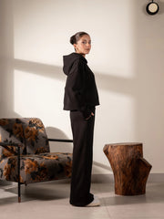Side view of the Soho black matching set showing the hood, boxy top and wide-leg trousers.