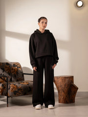 Full-length front view of the Soho black winter hoodie set showing the boxy hoodie and wide-leg trousers.
