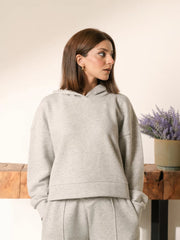 Closer front view of the Soho Heather Grey hoodie showing the hood neckline, boxy fit and long sleeves.