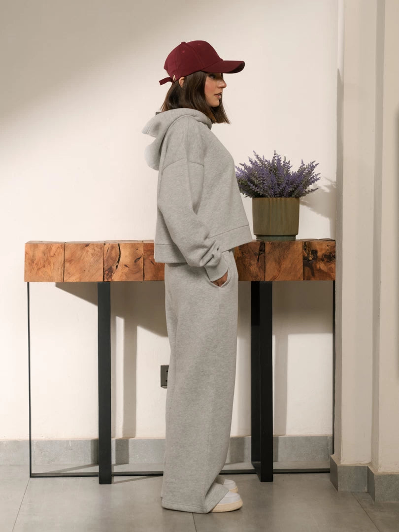 Side and back view of the Soho Heather Grey matching set showing the hood resting on the back and matching trousers.