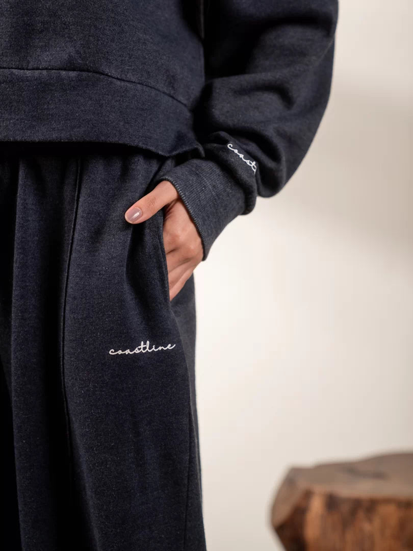 Close-up of Soho Midnight Blue wide-leg trousers showing the side pocket and relaxed fit