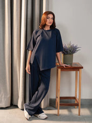 Full-length angled view of the Sorelle Oxford Blue summer co-ord set showing the loose top and flowing wide-leg trousers.