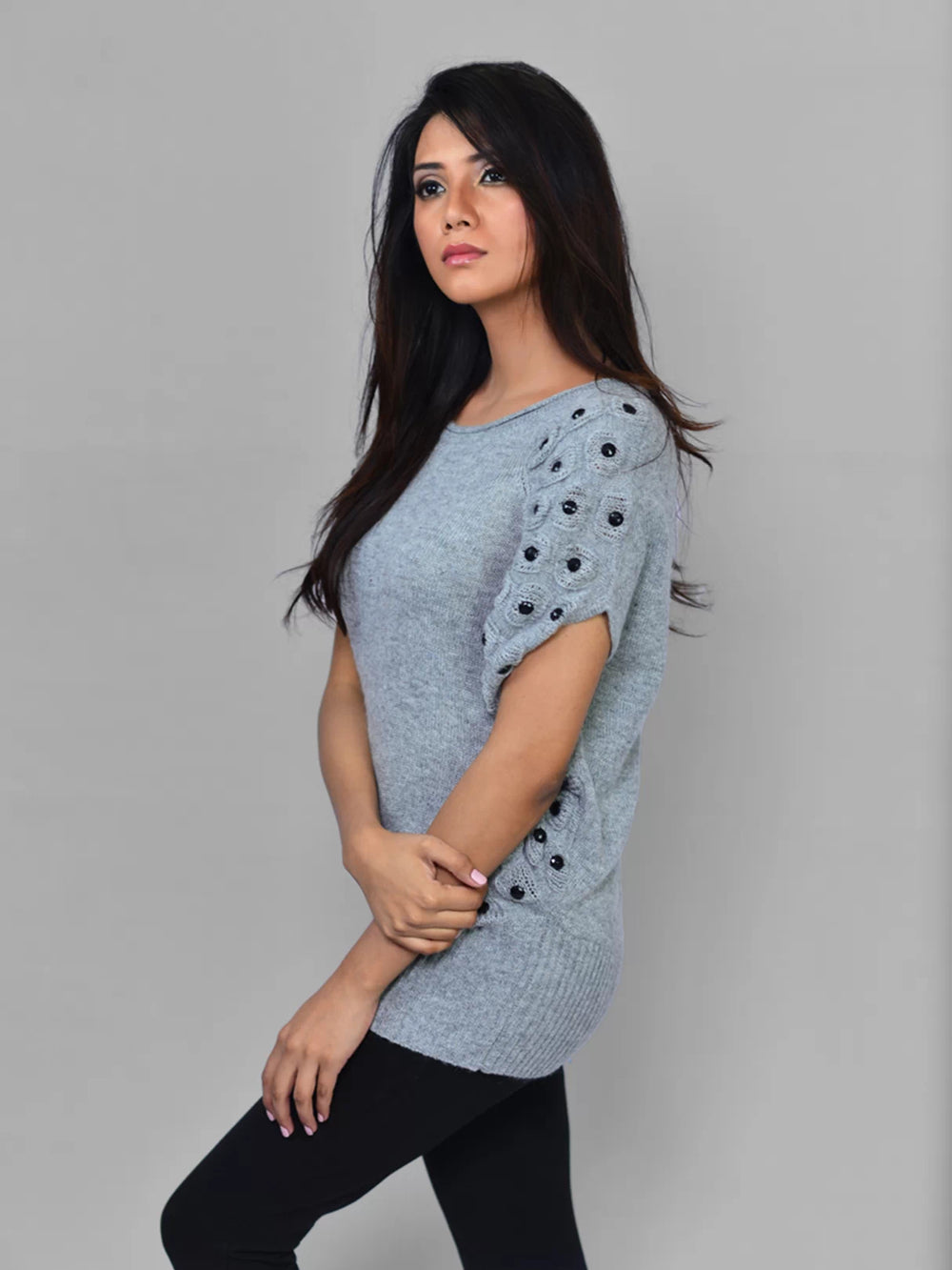Side view of Coastline's Studded Rihanna Sweater in Koala Grey, showing the fitted silhouette and embellished sleeve.