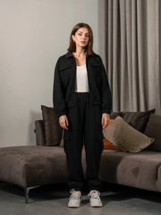 Varley Black women's matching set with collared zip-up jacket and cargo trousers front view