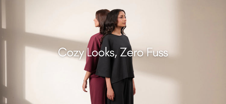 Two women wearing relaxed matching sets in black and burgundy