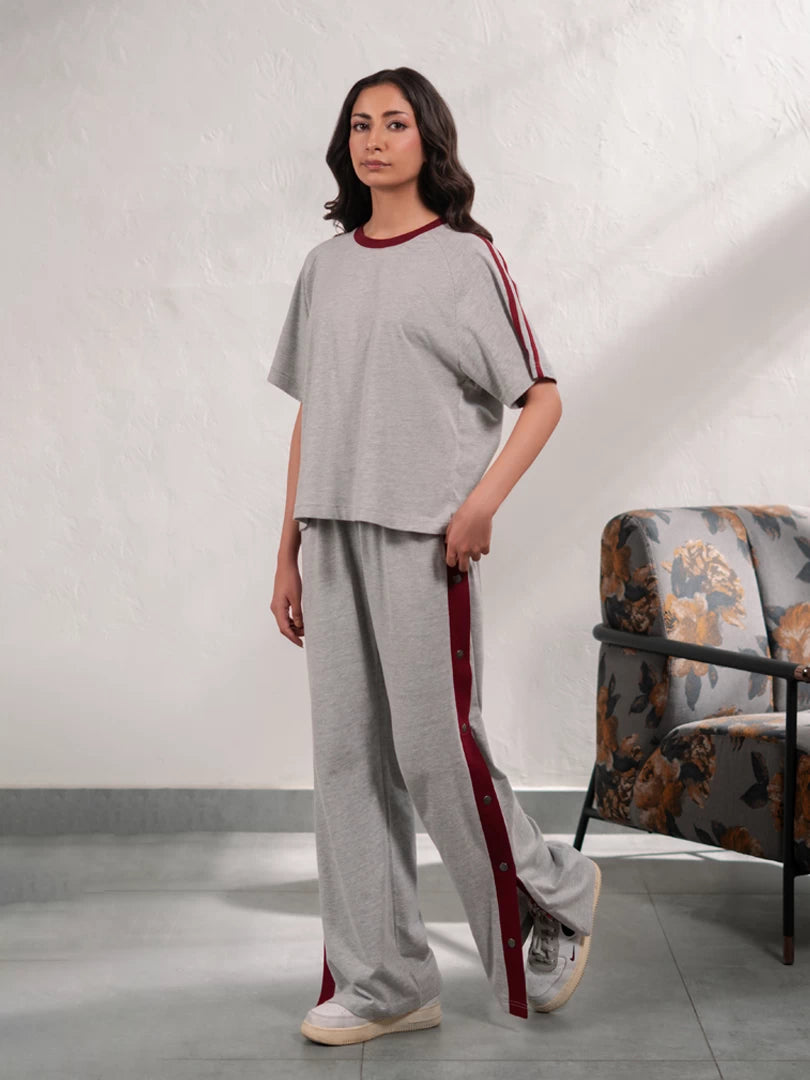 Zoey Heather Grey summer co-ord set for women featuring a loose-fit top with contrast sleeve tape and matching wide-leg trousers.