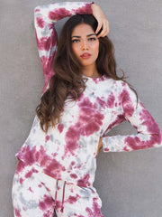 Model wearing the Ocean Drive Purple tie dye matching set with an all-over print and coordinated trousers